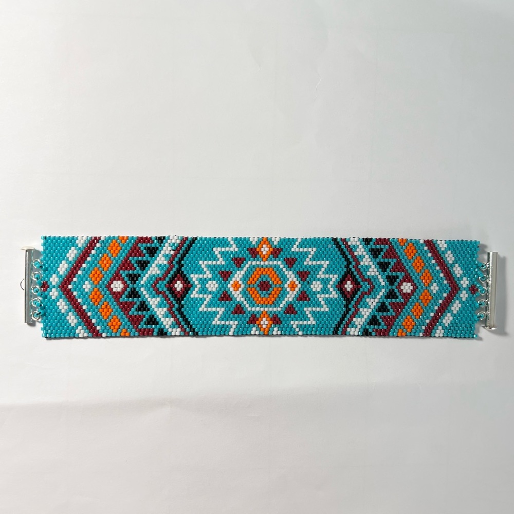 Handcrafted beadedAztec treasure peyote bracelet .
